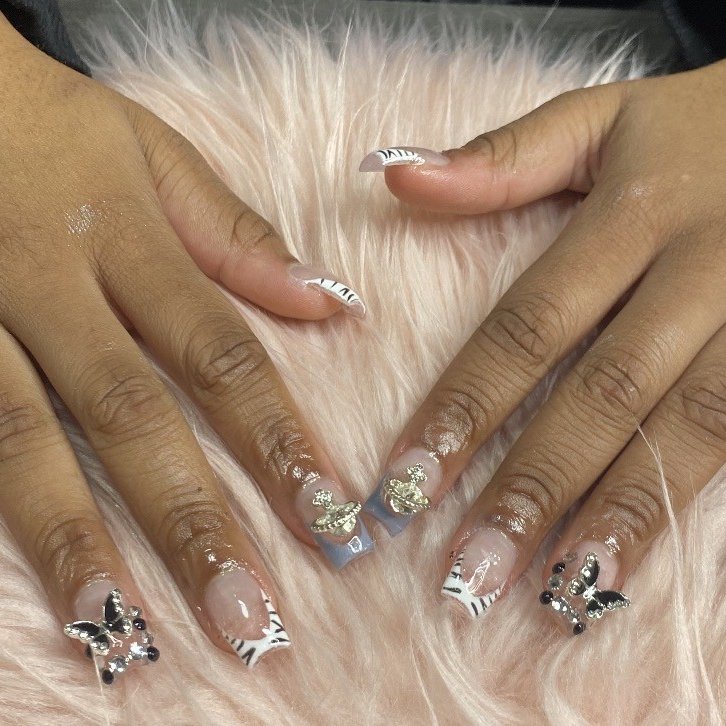 Zebra print acrylic set with 3D butterfly charms by Lovely K Nails