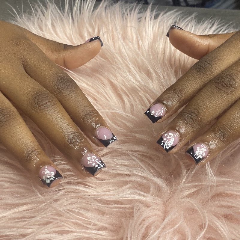 Pink and black acrylic French tip set with hand-painted floral design by Lovely K Nails